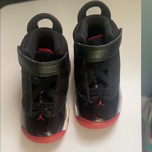 Jordan Black and Red High-Top Sneakers with Athletic Design